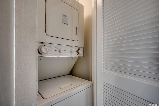 laundry area featuring stacked washer and dryer