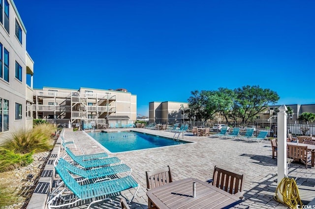 view of pool featuring a patio