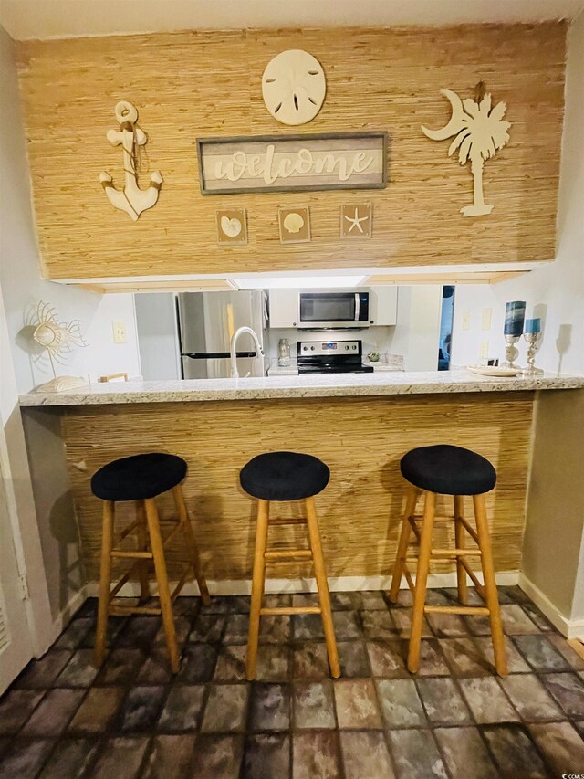 bar with stainless steel appliances