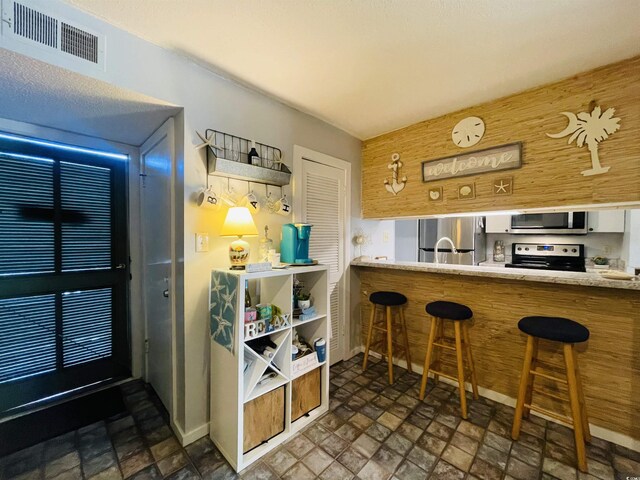 bar with appliances with stainless steel finishes