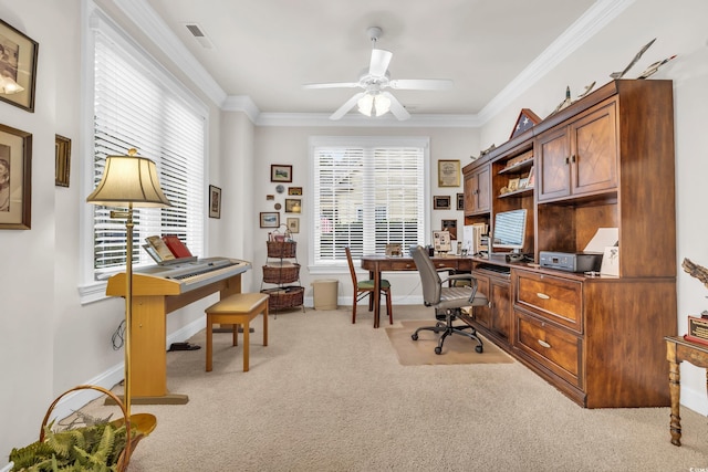 carpeted office space with ceiling fan and crown molding