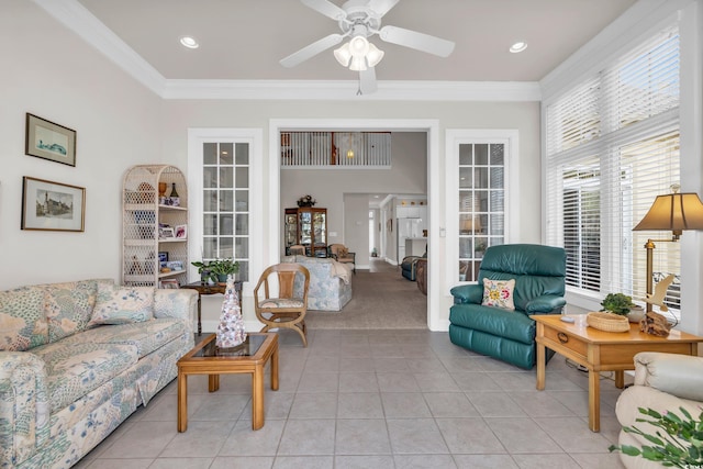 tiled living room featuring ornamental molding and ceiling fan