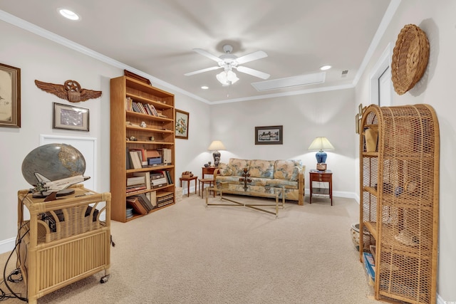 carpeted living room with ceiling fan and crown molding