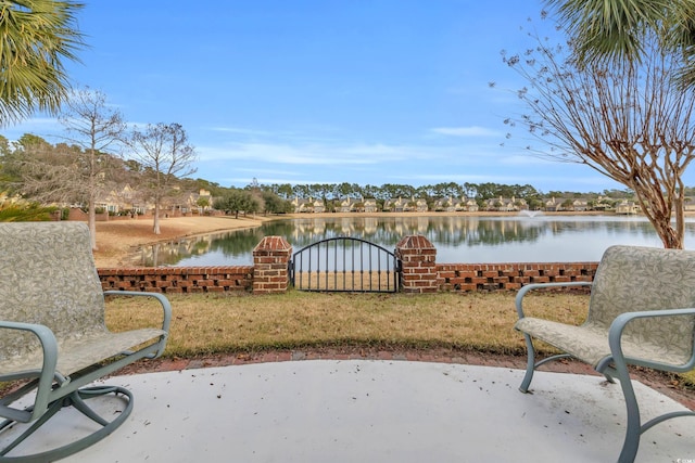 view of patio with a water view