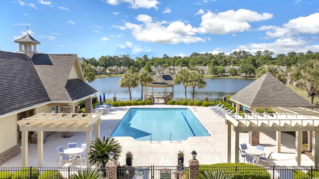 view of swimming pool with a pergola, a water view, a patio, and a gazebo