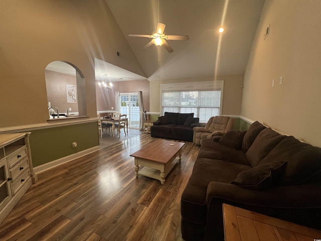 living room featuring ceiling fan, dark wood-type flooring, and high vaulted ceiling