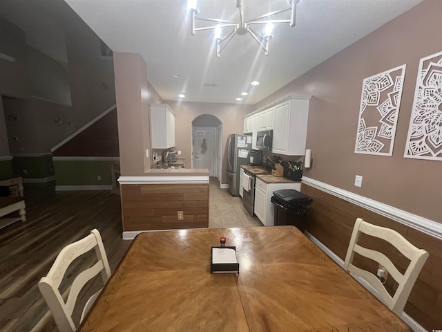 389 Cabo Loop, Myrtle Beach, SC 29588 - dining room featuring arched walkways and a chandelier