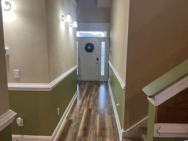 foyer entrance with dark hardwood / wood-style floors