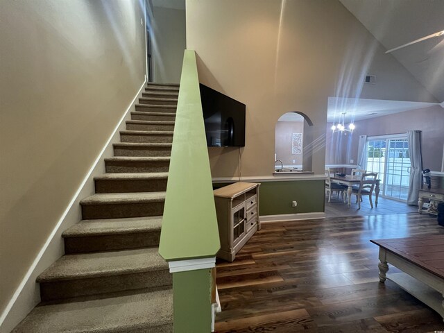 living room featuring dark hardwood / wood-style flooring and ceiling fan