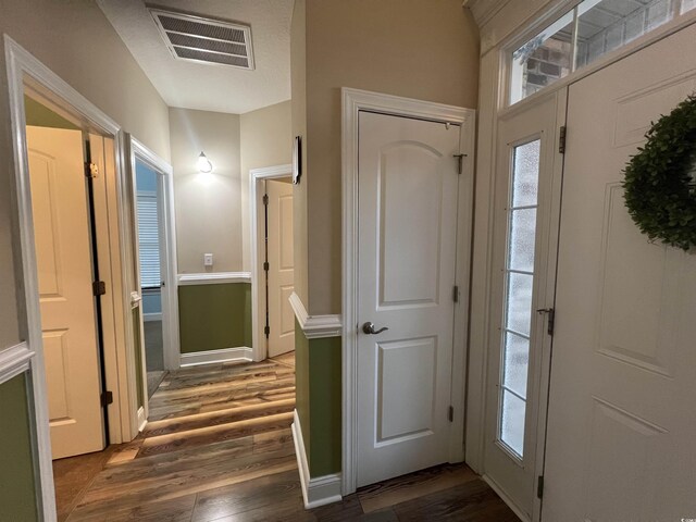 entryway with dark wood-type flooring