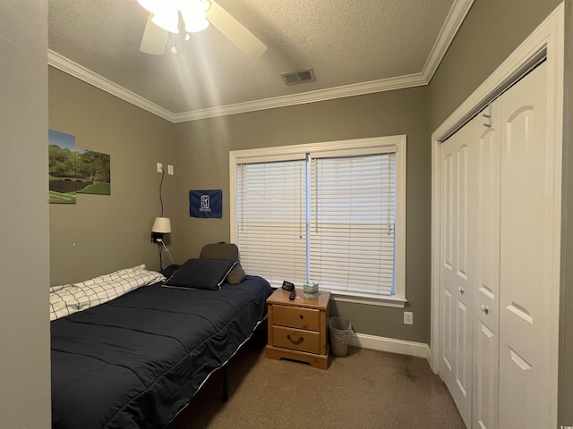 389 Cabo Loop, Myrtle Beach, SC 29588 - bedroom featuring carpet, a closet, crown molding, baseboards, and a textured ceiling