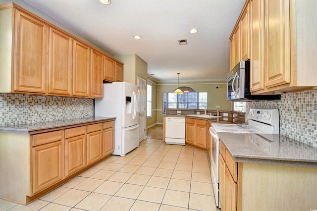 kitchen with white appliances, light tile patterned flooring, kitchen peninsula, hanging light fixtures, and crown molding