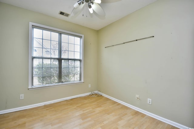 spare room with ceiling fan and light hardwood / wood-style floors