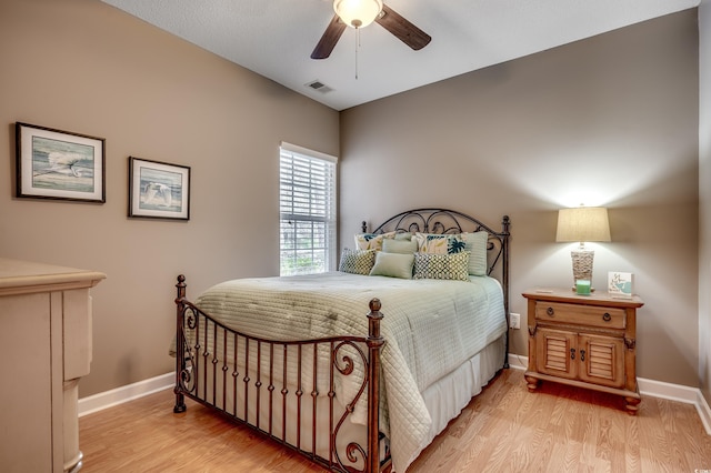 bedroom with light wood-type flooring and ceiling fan