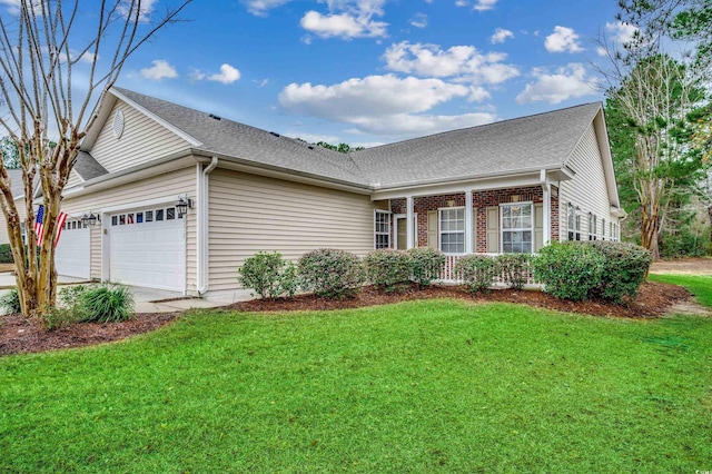 view of front of house with a front lawn and a garage