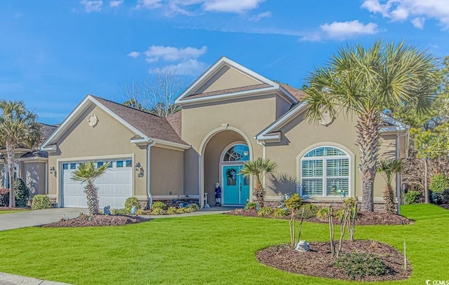 view of front of home featuring a garage and a front lawn