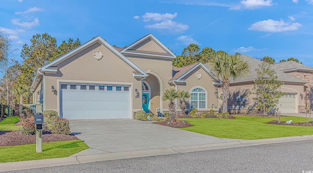 view of front of property featuring a garage and a front yard