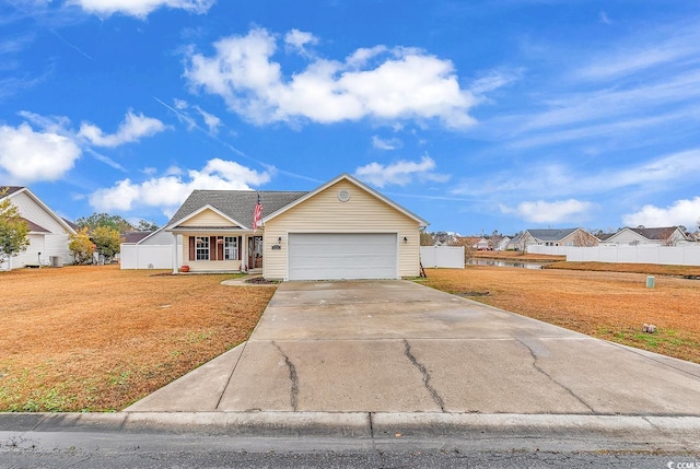 view of front of home with a front lawn and a garage