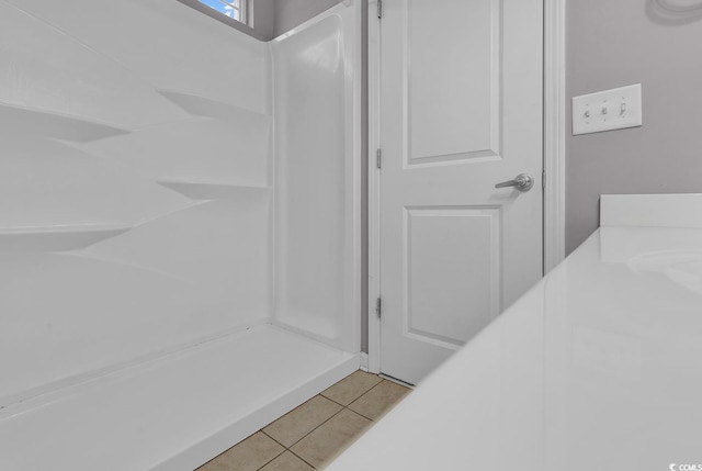 bathroom with tile patterned floors