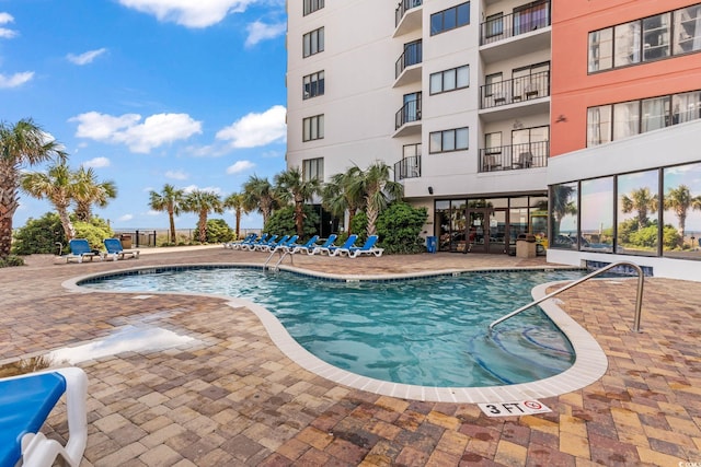 view of swimming pool featuring a patio