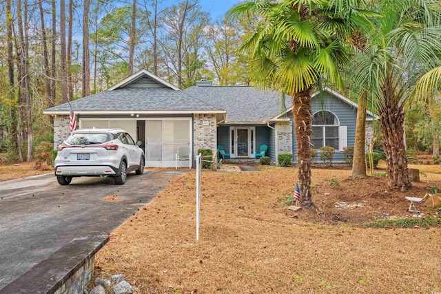 single story home featuring a garage