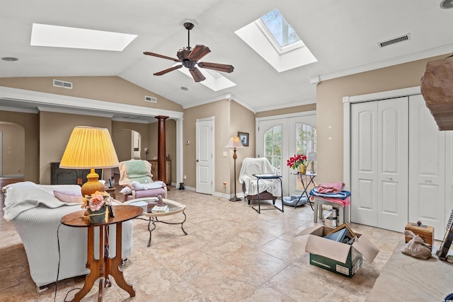 living room featuring ceiling fan, lofted ceiling, and crown molding