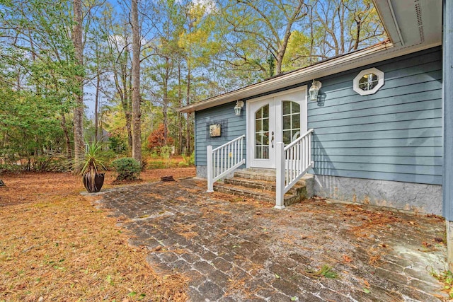 doorway to property featuring french doors