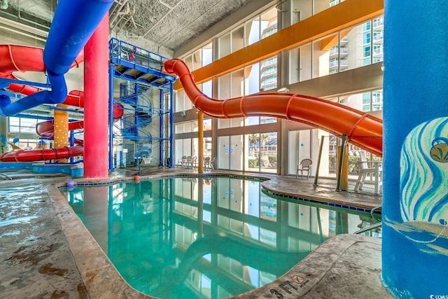 community pool with a water slide