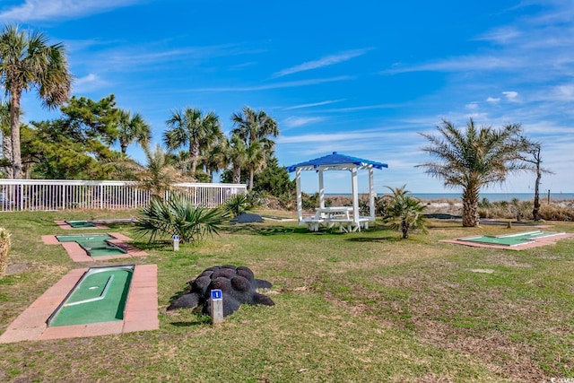 surrounding community featuring a lawn and fence