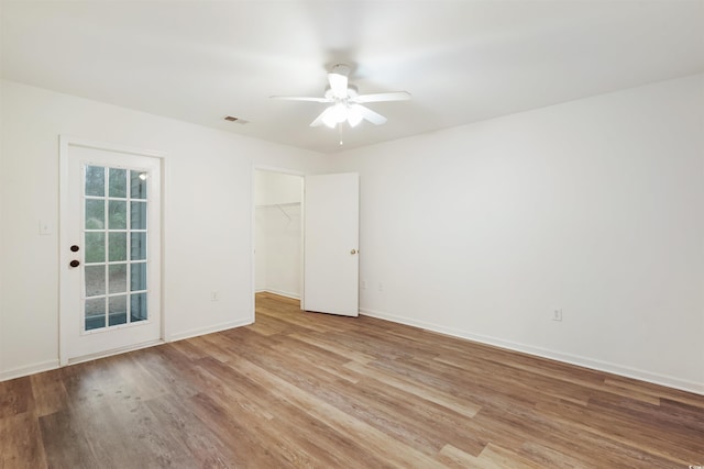 unfurnished room featuring ceiling fan and light hardwood / wood-style floors