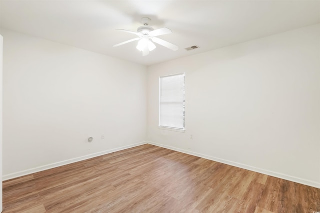 spare room featuring ceiling fan and light hardwood / wood-style floors