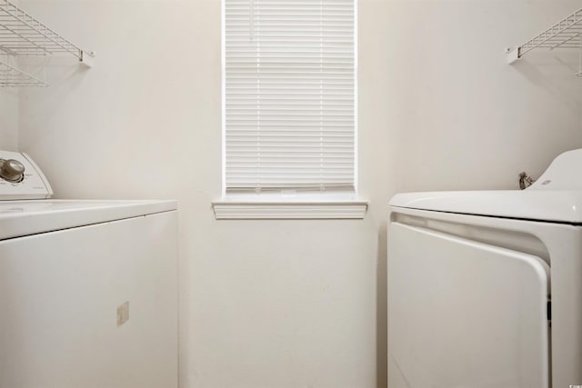 laundry area with washing machine and dryer