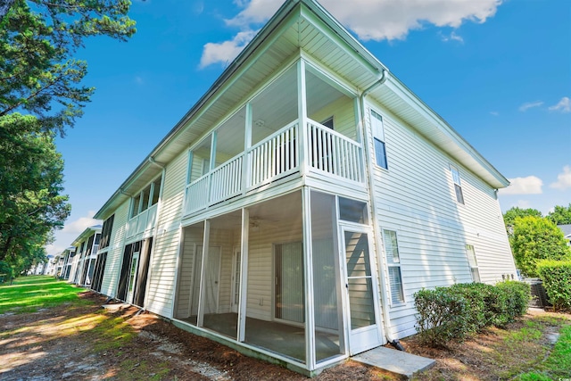 view of property exterior with a balcony