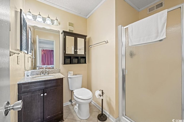 bathroom featuring toilet, a textured ceiling, tile patterned floors, a shower with shower door, and vanity