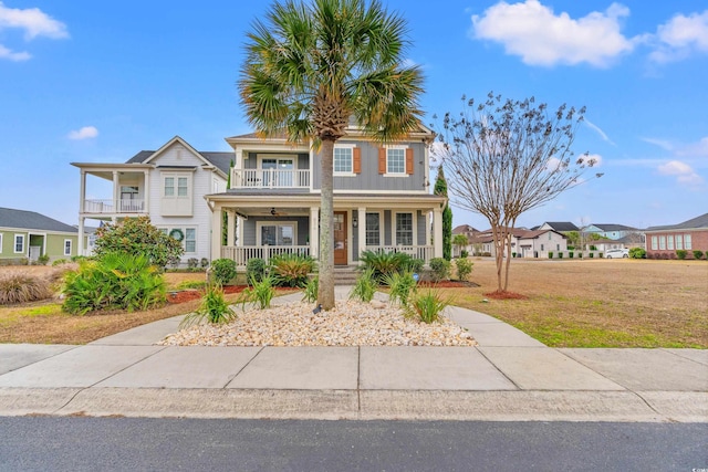 view of front of property with a balcony and a porch