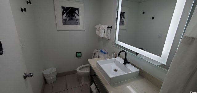 bathroom with vanity, tile patterned floors, and toilet