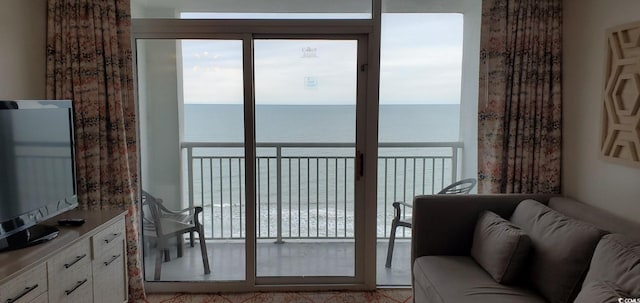 interior space with plenty of natural light and a water view