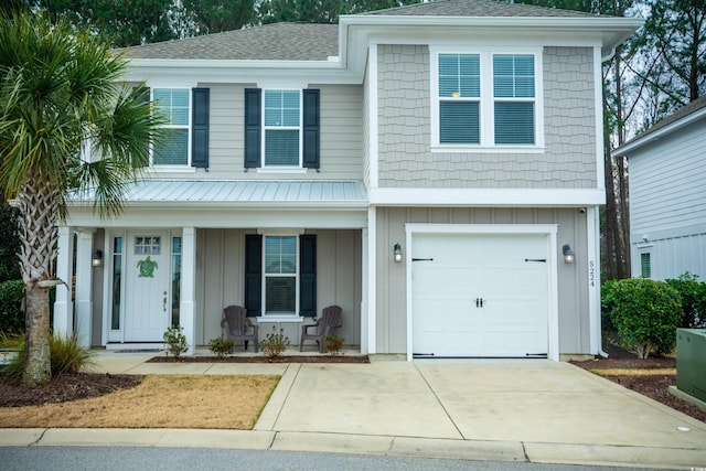 view of front facade with a garage and a porch