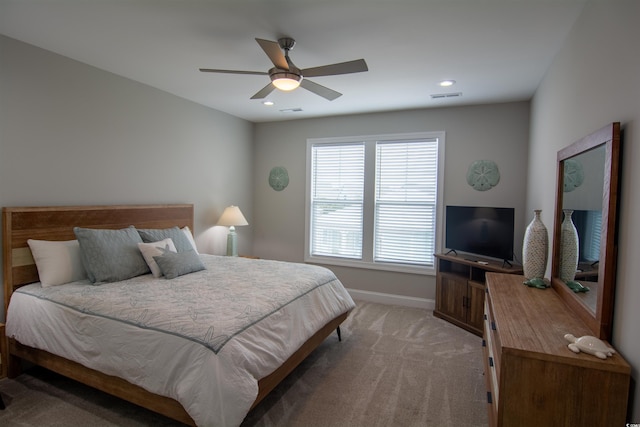 bedroom featuring ceiling fan and light colored carpet