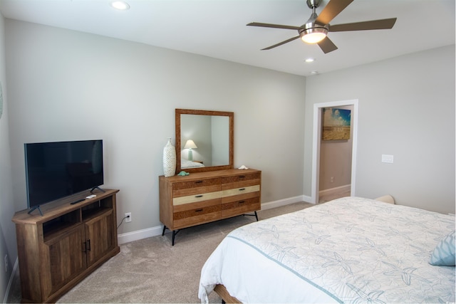 bedroom with light colored carpet and ceiling fan