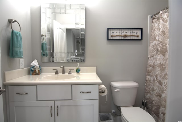 bathroom with toilet and vanity