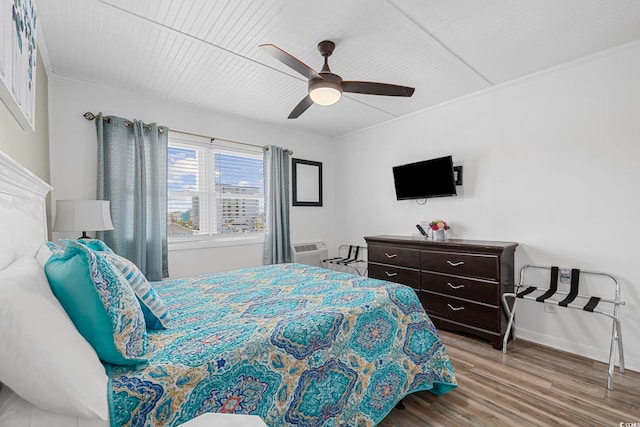 bedroom with ceiling fan and wood-type flooring