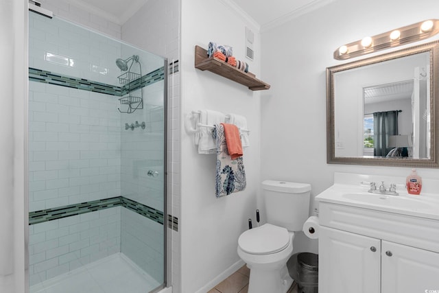 bathroom featuring toilet, walk in shower, crown molding, vanity, and tile patterned floors