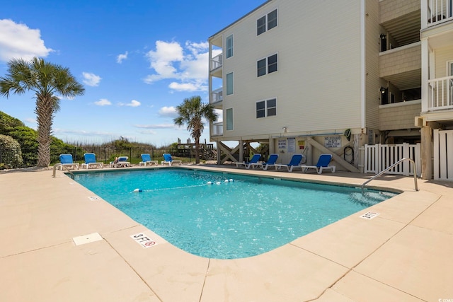 view of swimming pool featuring a patio area