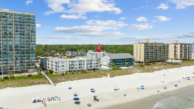 bird's eye view with a water view and a view of the beach