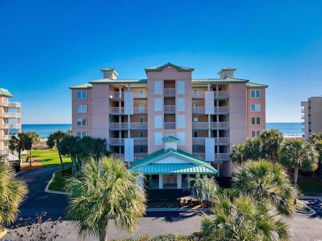 view of building exterior with a water view