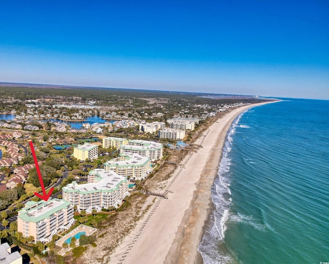 bird's eye view featuring a beach view and a water view