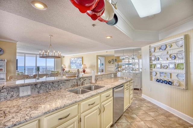 kitchen with crown molding, dishwasher, cream cabinetry, and sink