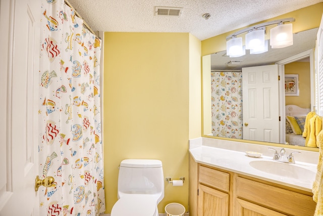 bathroom with toilet, a textured ceiling, a shower with curtain, and vanity