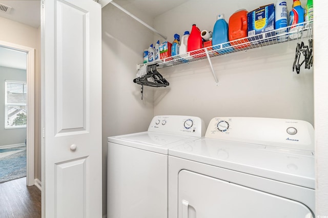 washroom with hardwood / wood-style floors and washer and clothes dryer